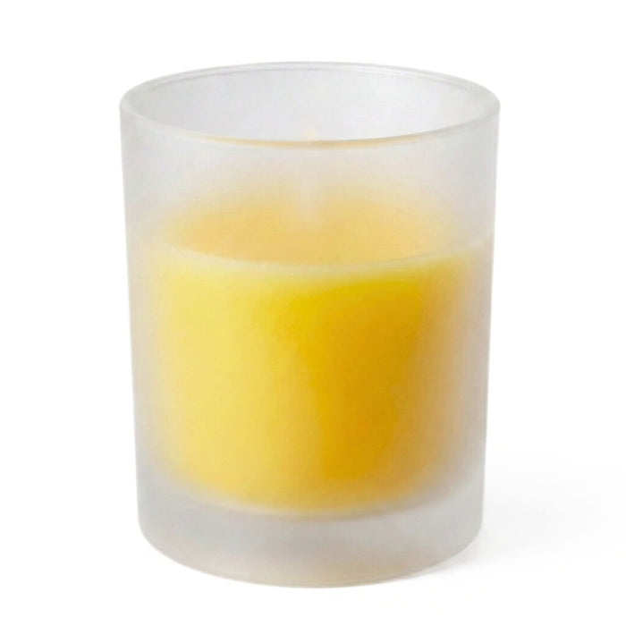 Yellow unscented candle in frosted glass votive holder