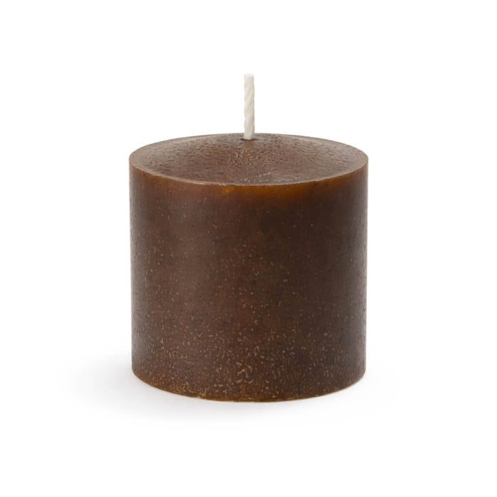 Unscented brown pillar candle isolated on a white background