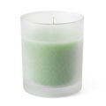 Green unscented candle in frosted glass votive holder