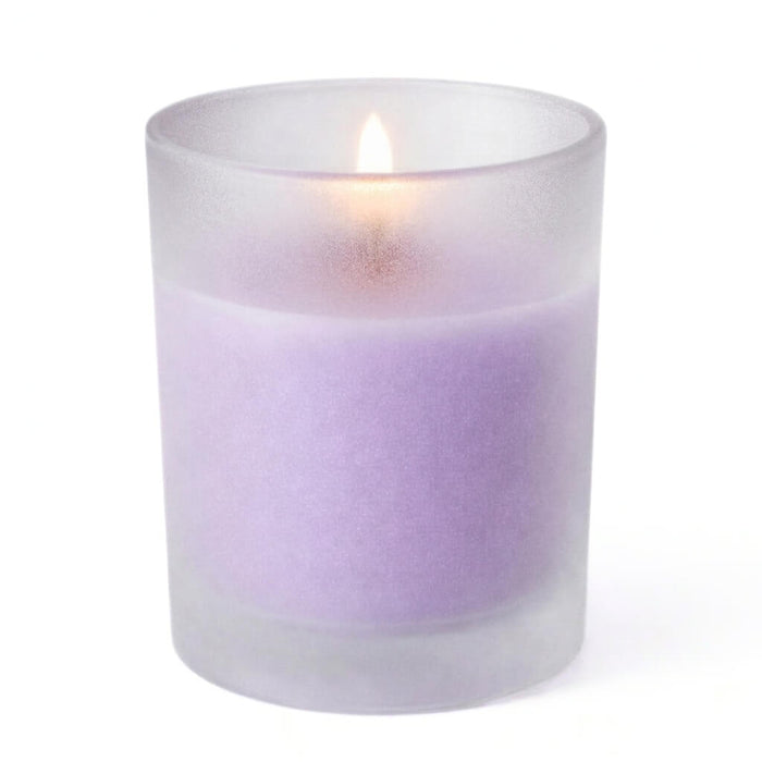 Single lavender candle glowing inside Frosted Votive Holders against white