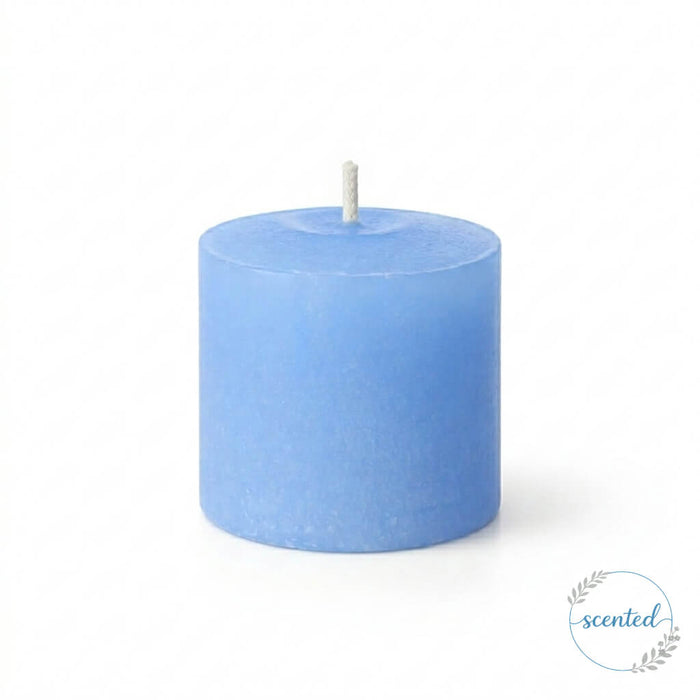 Unlit candle in Light Blue Ocean Breeze Scented on a solid white background