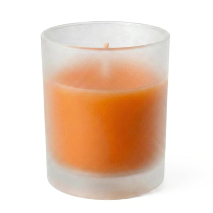 Orange unscented candle in frosted glass votive holder