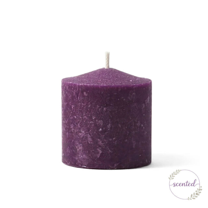 Purple Mulberry scented votive candle on a white backdrop
