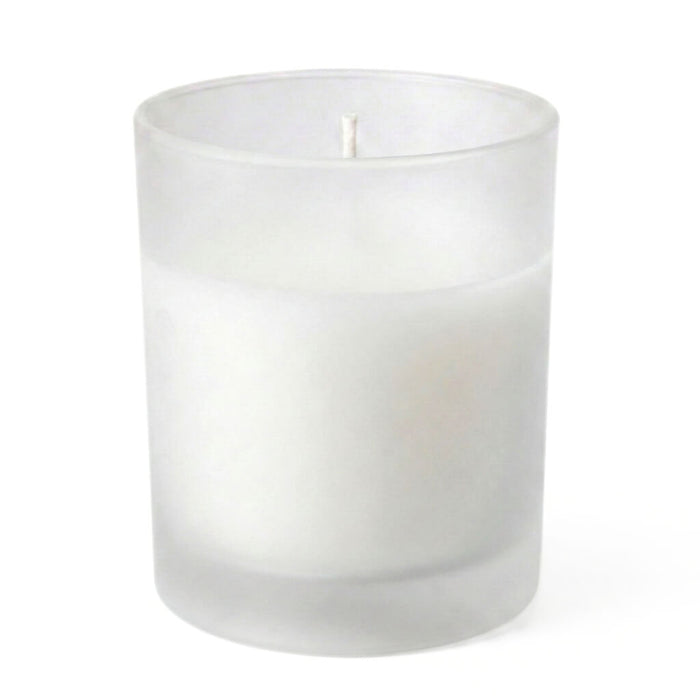 White unscented candle in frosted glass candle holder