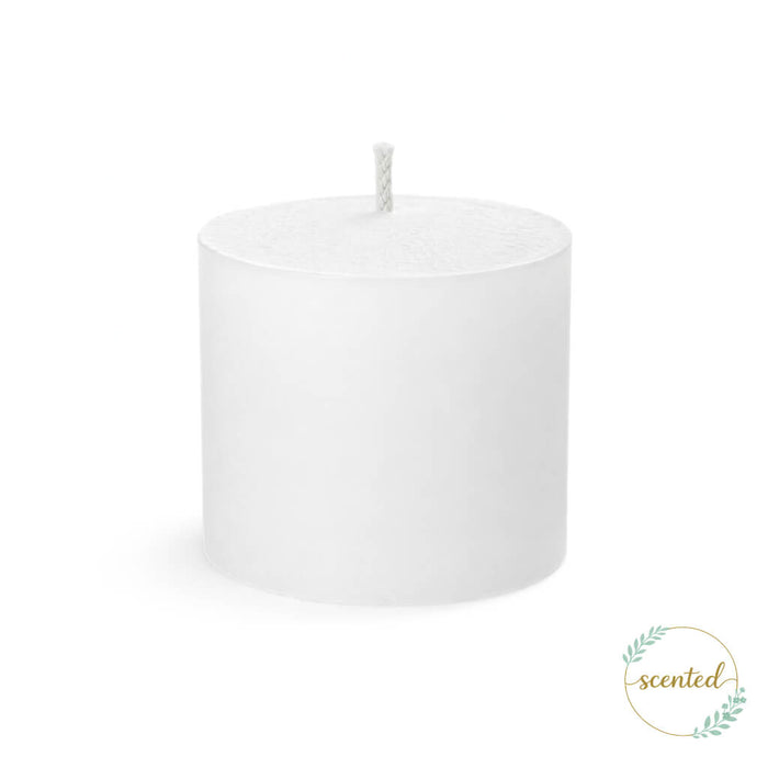 An unlit white votive citronella candle on a white background with a logo sticker