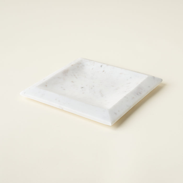 White marble pedestal with a sleek design.